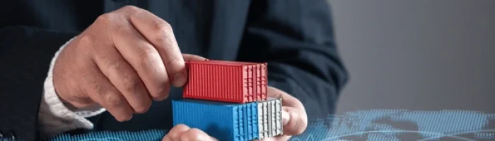 businessman-holding-shipping-containers-against-600nw-2592921649